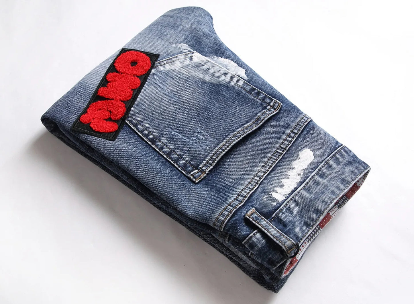 European and American process washed personalized embroidered with badges elastic jeans