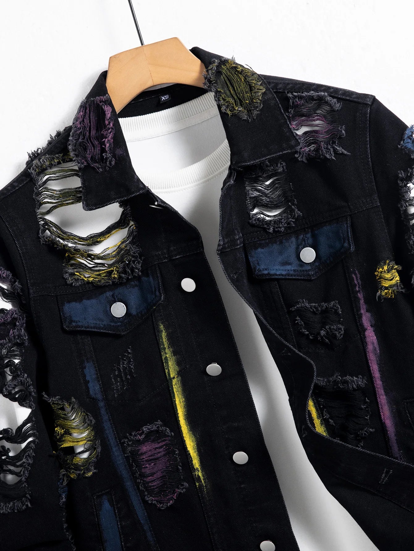 Men's black ripped denim jacket w/ Random paint splashing.