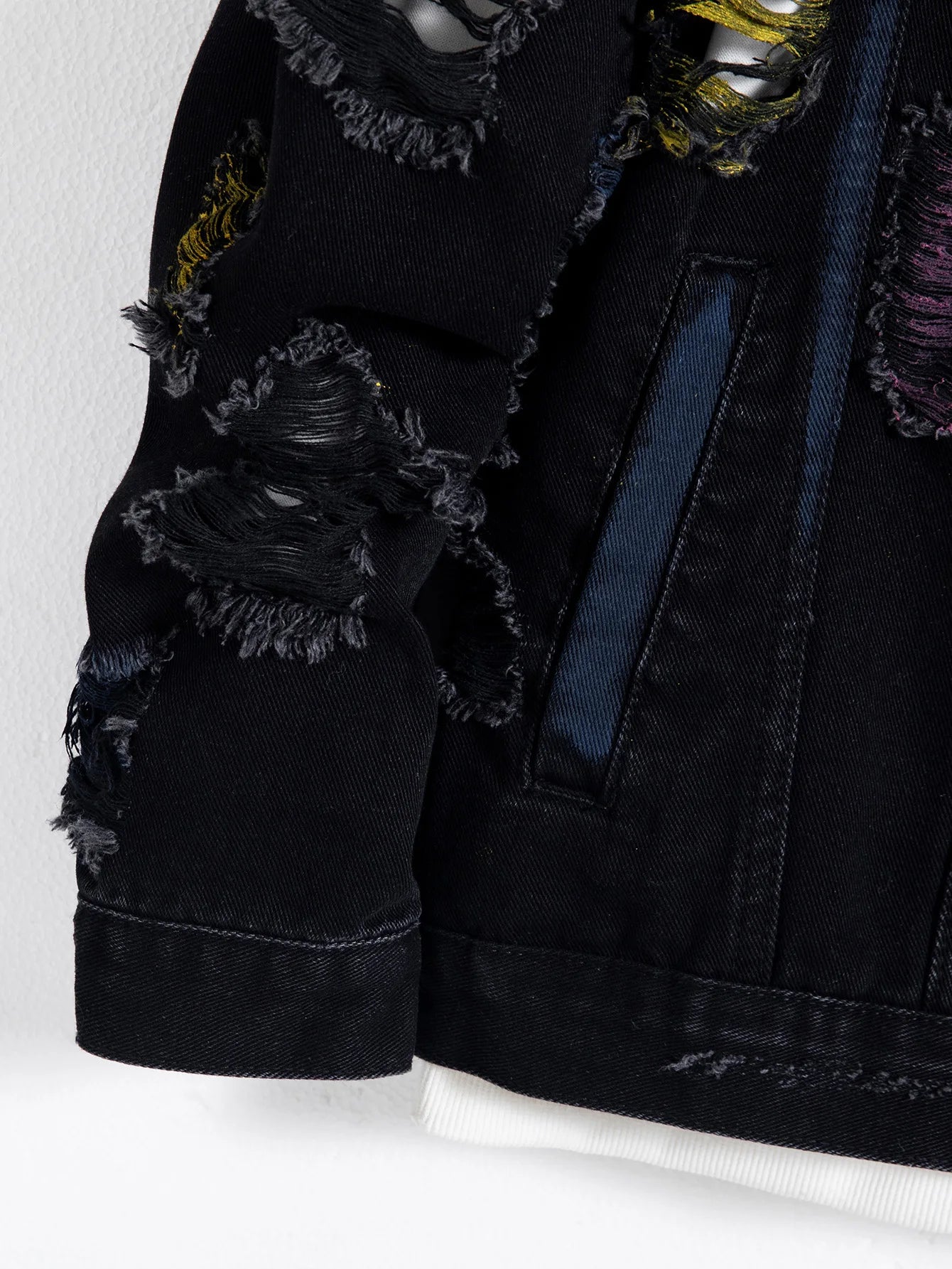 Men's black ripped denim jacket w/ Random paint splashing.