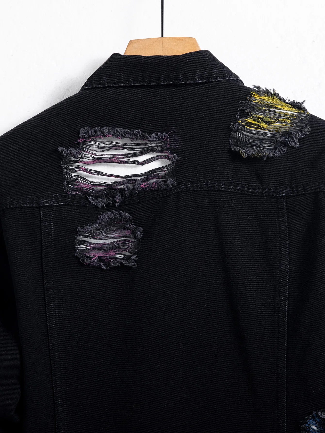 Men's black ripped denim jacket w/ Random paint splashing.